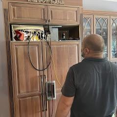 Belco Professional, LLC technician repairs a refrigerator in Sarasota, FL